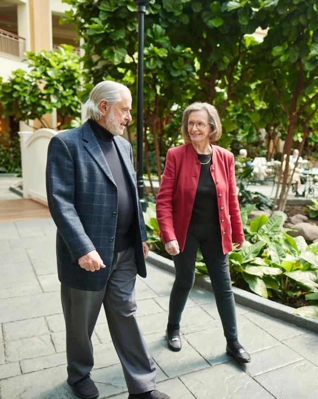 Seniors walking in indoor garden