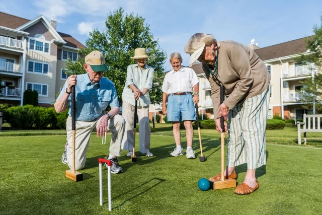 Seniors playing croquet
