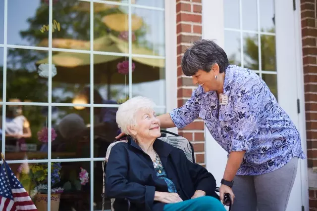 Caregiver and senior outdoors