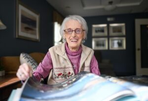 Woman reading scrapbook
