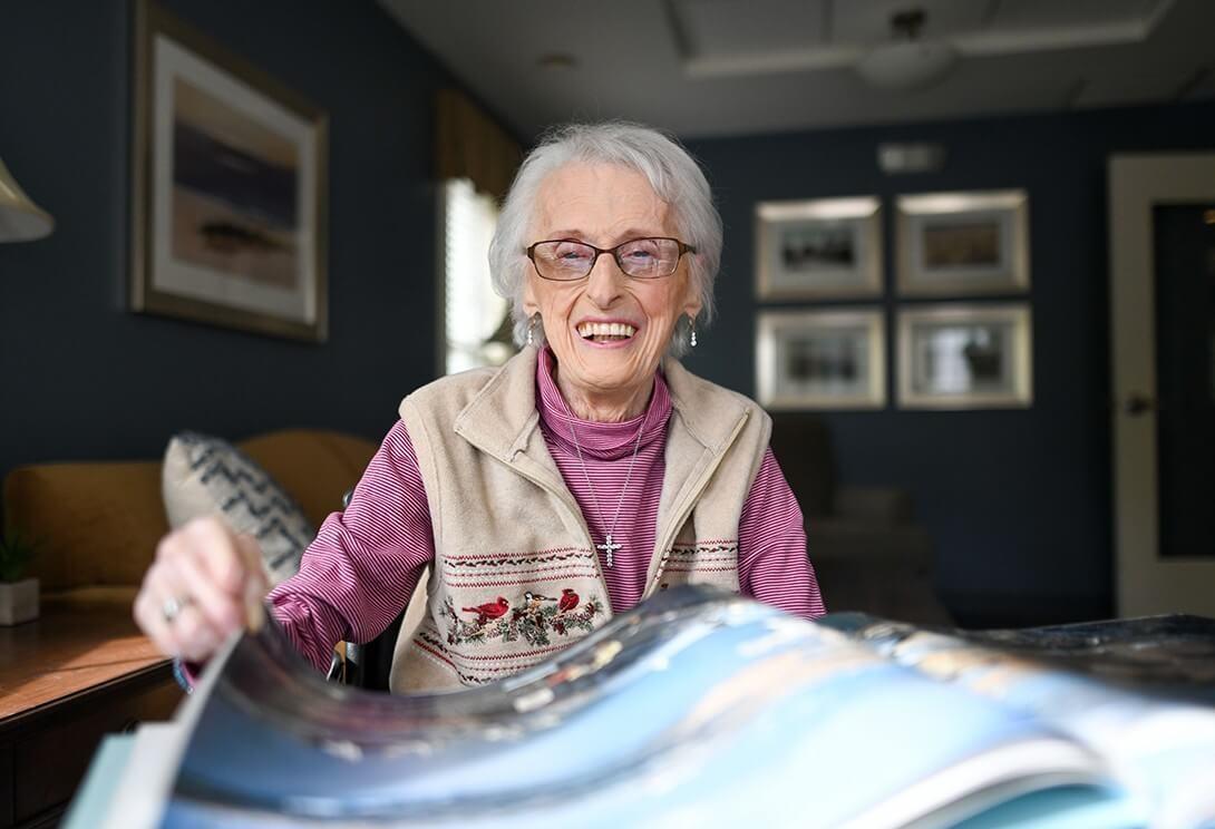 Woman reading scrapbook