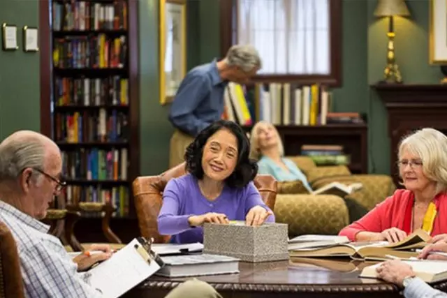 Seniors reading in library room