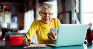 Woman writing on notepad