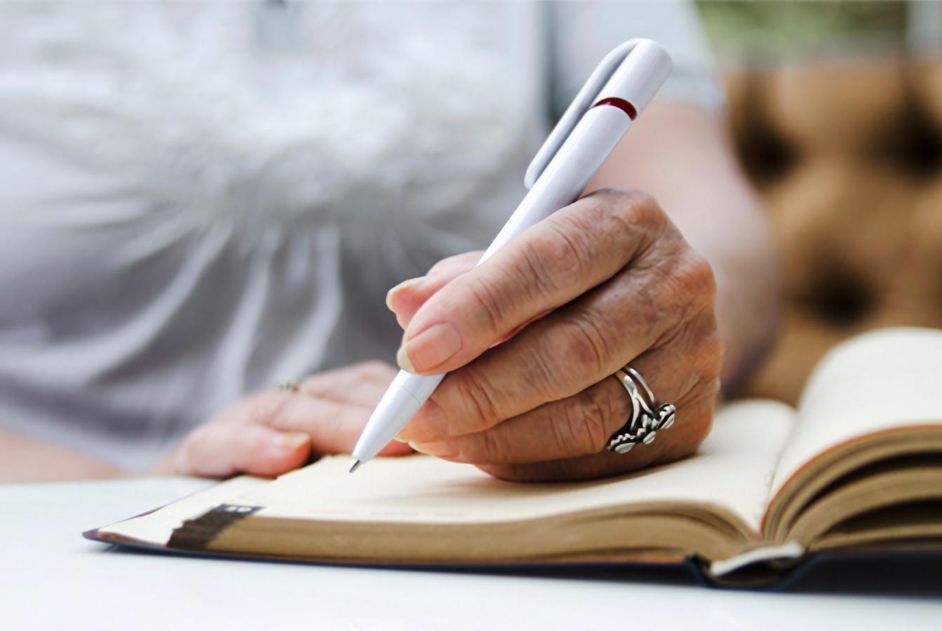 Woman writing in journal