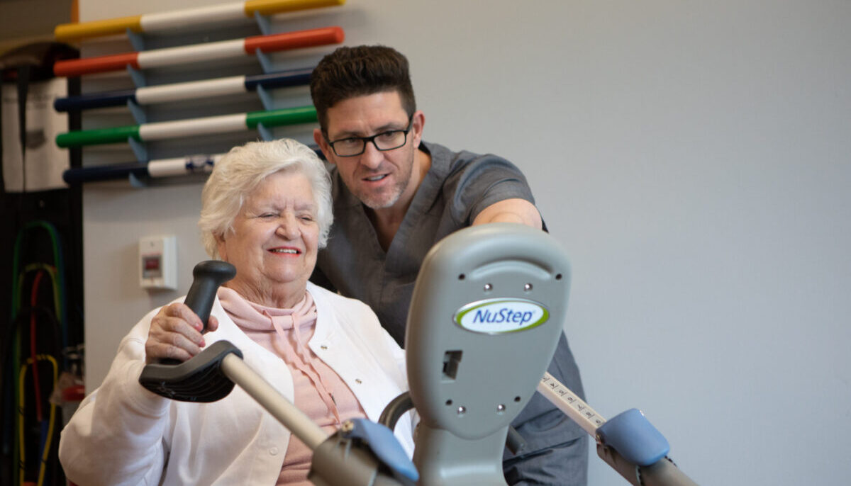 Senior resident Judy M. exercising