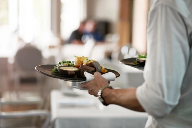 Server with beef dishes