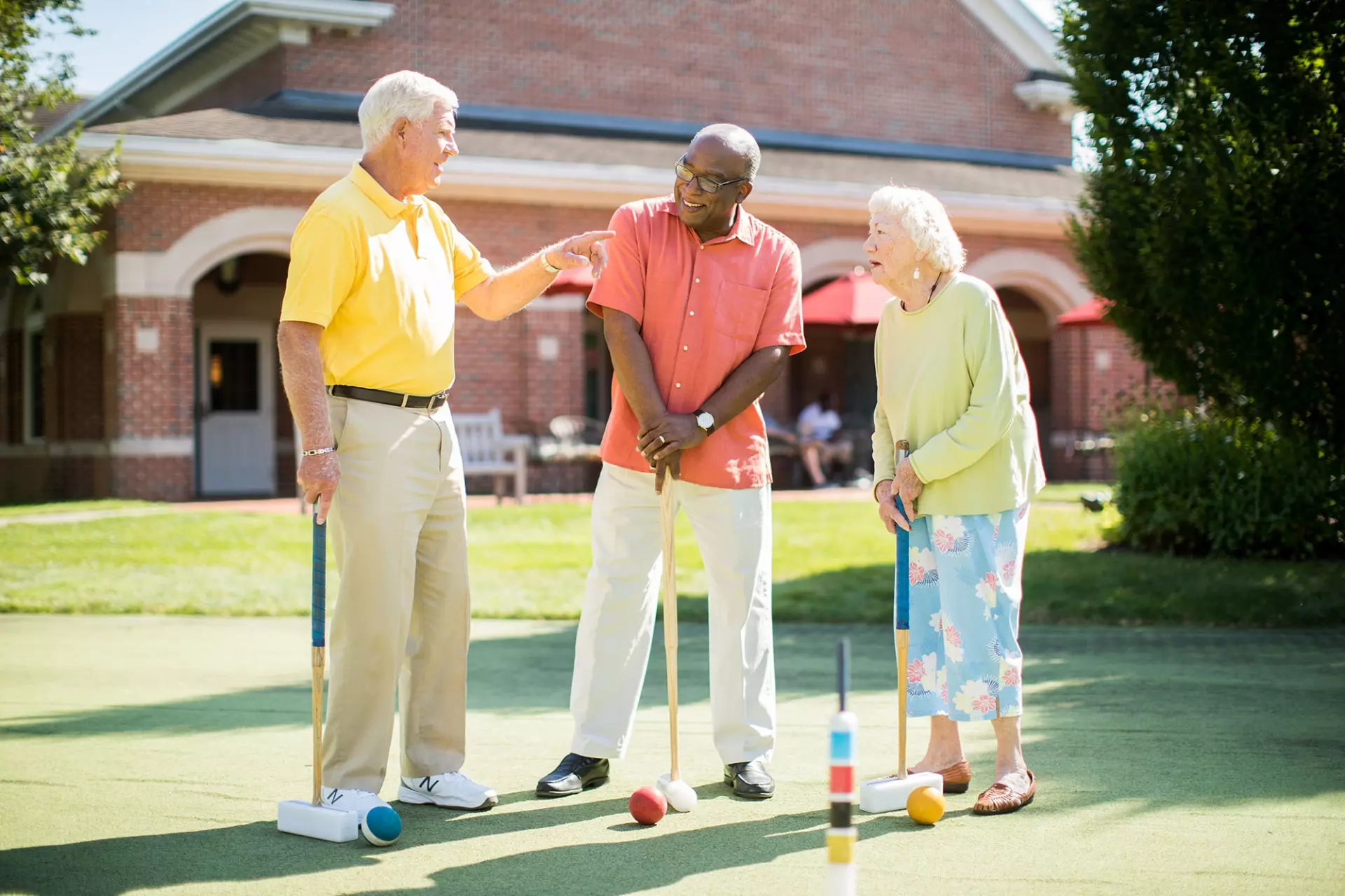 Seniors playing croquet