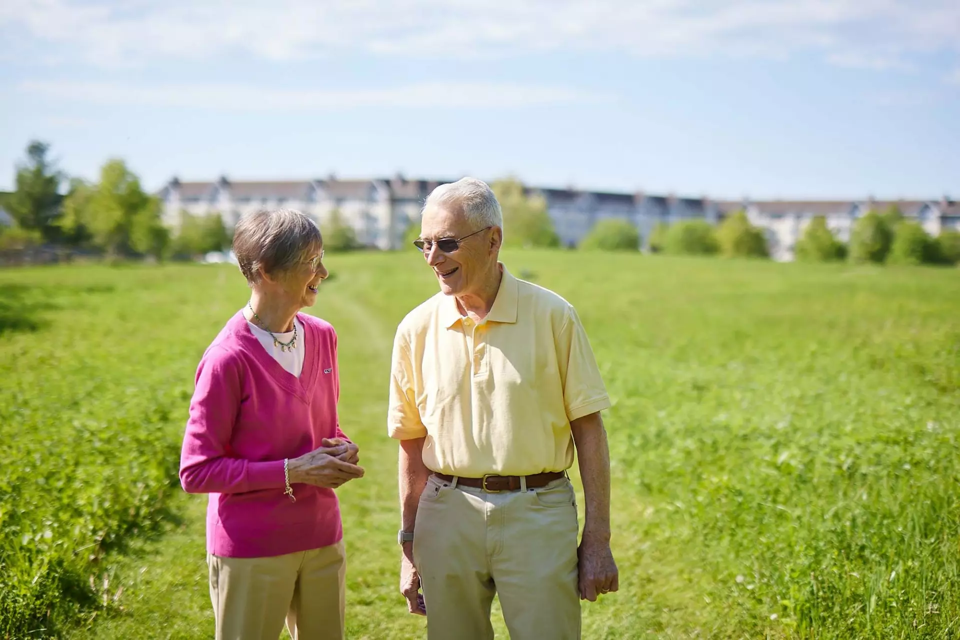 Senior man and woman speaking outdoors