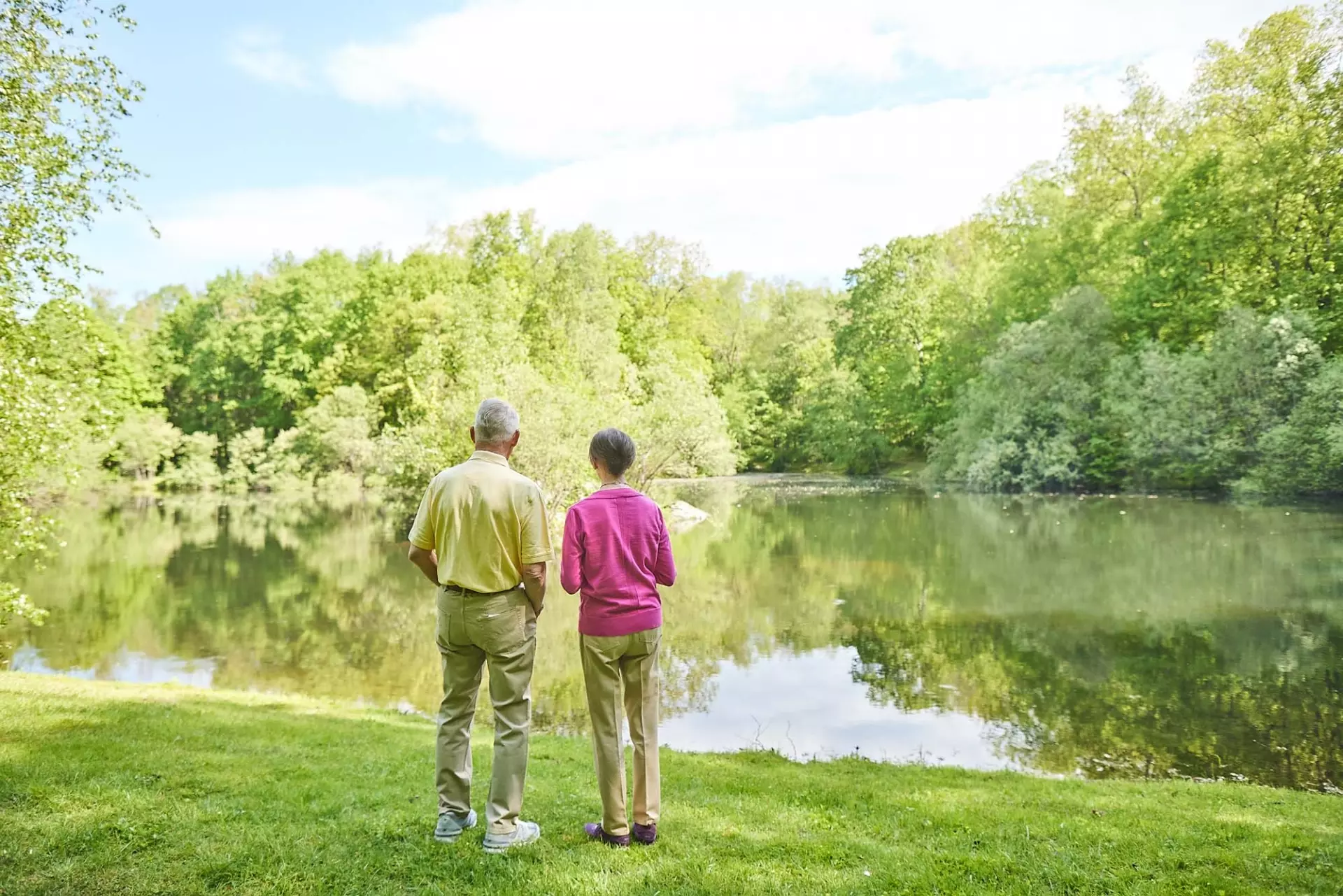 Senior man and senior woman at lake