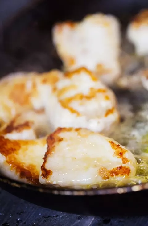 Scallops being fried