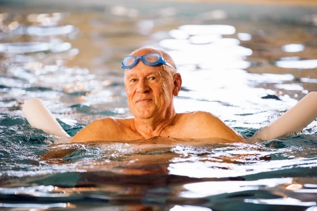 Senior man swimming