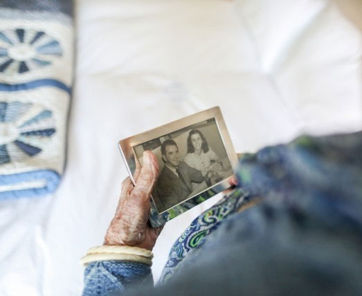 Resident looking at a photograph