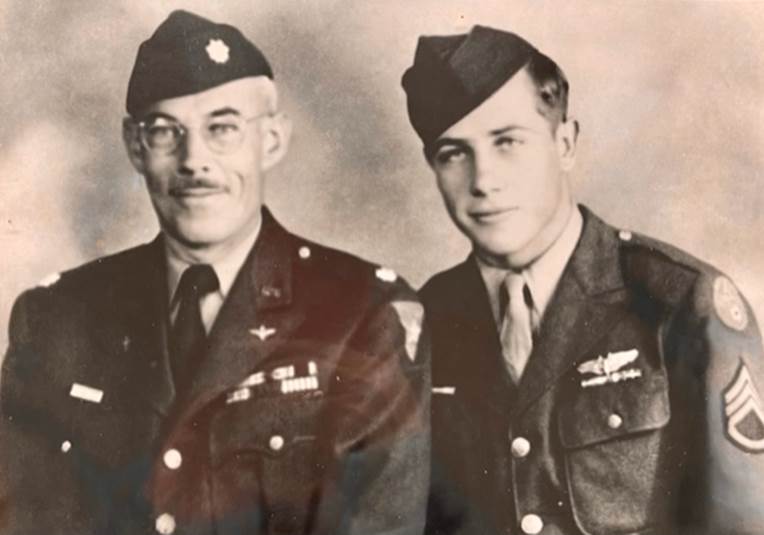 Bob Wylie, age 19, poses with his father.