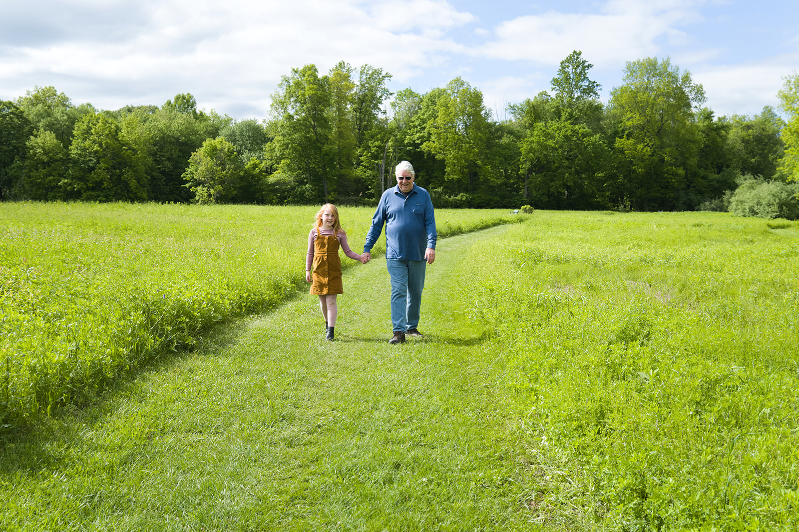 grandfather and granddaughter enjoy meadow ridge walking trails
