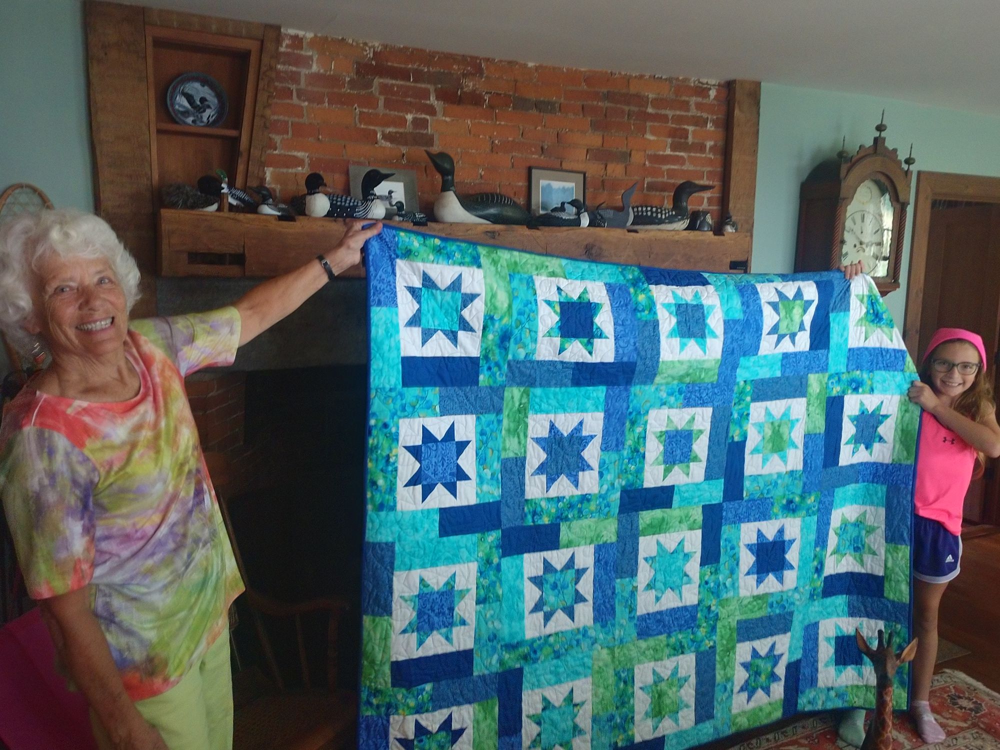 Resident Susan M. showing one of her many quilts