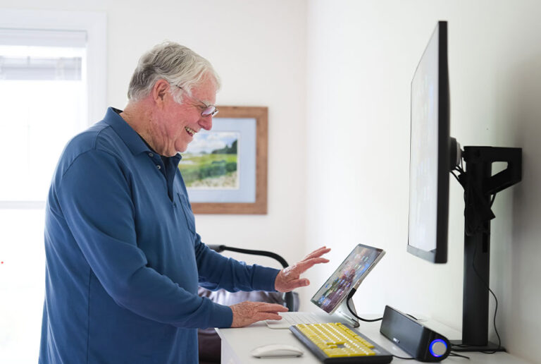 Meadow Ridge resident using computer