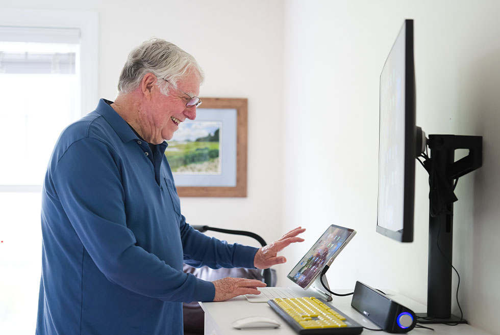 Meadow Ridge resident using computer
