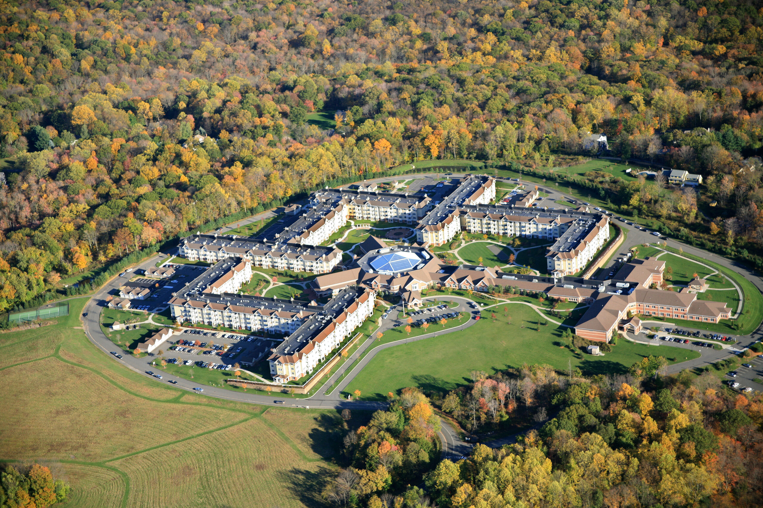 Aerial view of Meadow Ridge, home to Ridge Crest’s award-winning memory care, assisted living, and skilled nursing and rehab, set on 136 scenic hilltop acres in Redding, Connecticut.