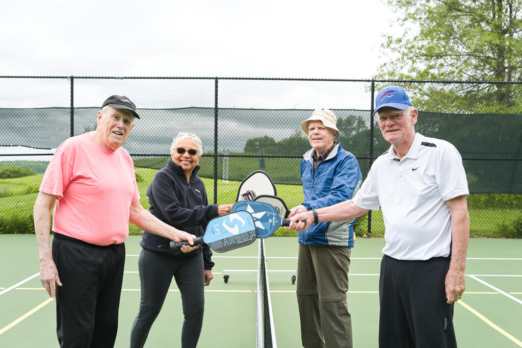 Residents playing pickleball