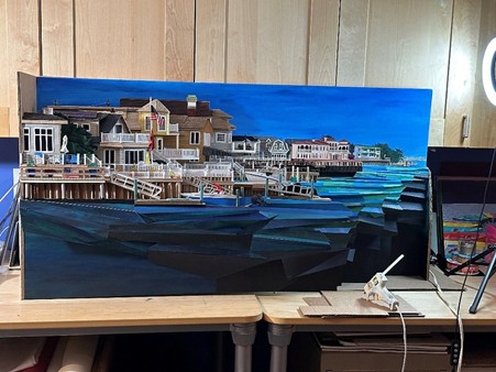 Bonnie’s centerpiece: a striking mixed-media cardboard sculpture on display at the exhibit.